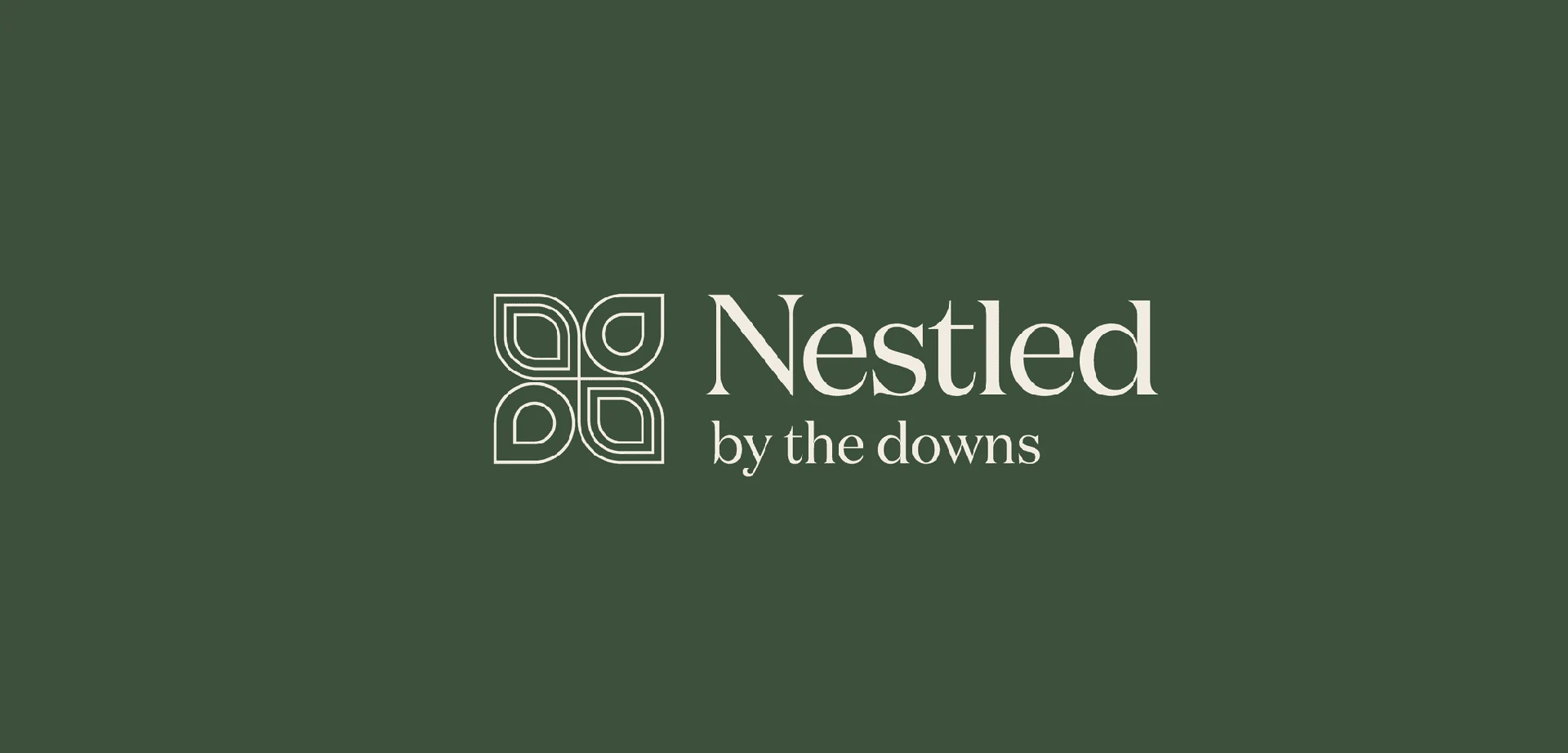 Nestled wordmark and By the Downs tagline on a dark green background